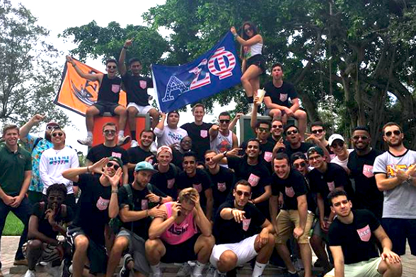 Alpha Sigma Phi group photo at the U statue